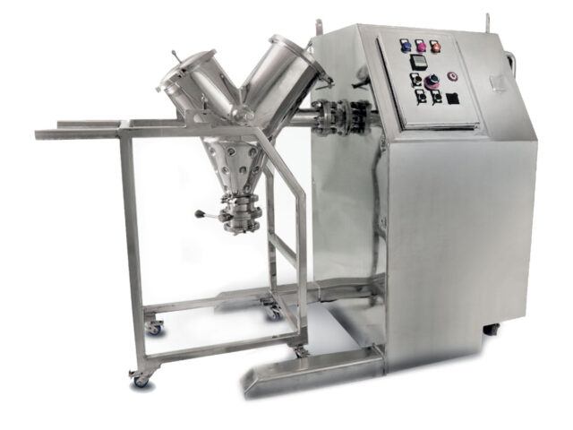 A V-blender, a machine for mixing substances, is shown in the image. It is used to blend different materials together.
